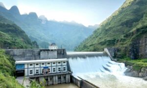 Civil engineers inspecting a dam with flowing water to highlight modern dam inspection trends