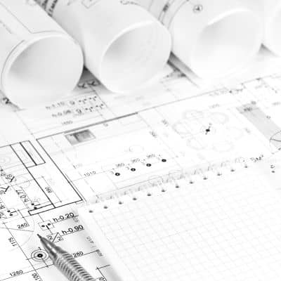 Rolled roadway engineering plans and design documents used during stormwater design planning for road and site projects