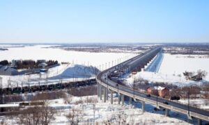 Winter bridge spanning a snowy landscape, showing how structural engineering decisions help manage safety risks in cold weather