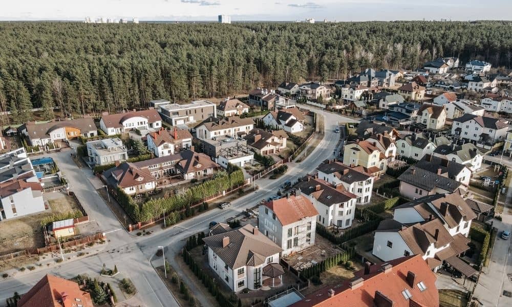 Aerial view of residential neighborhood showing a grading plan layout with proper drainage slopes around homes and fences