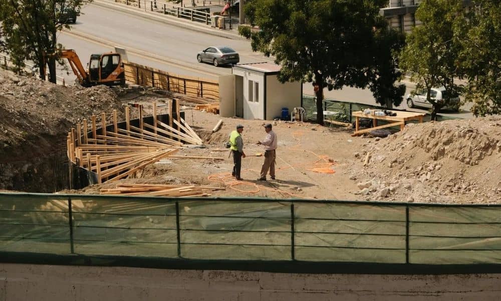 Construction site showing erosion control plan measures in place to protect soil and manage runoff during grading work