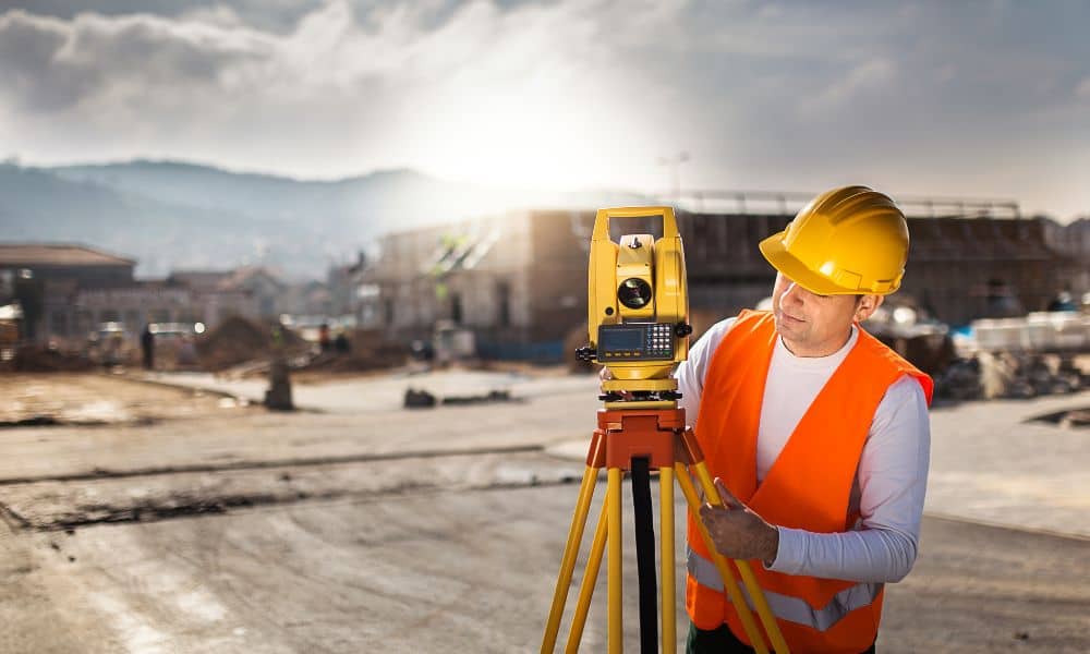 Surveyor conducting an ALTA survey at a commercial property