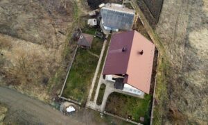 Aerial view of a residential property with a fence around the yard, showing the boundaries a boundary survey can help confirm before building a new fence
