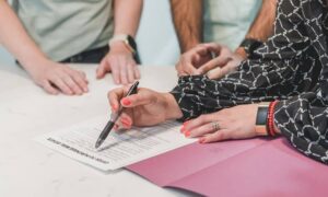 People reviewing title documents before an ALTA survey